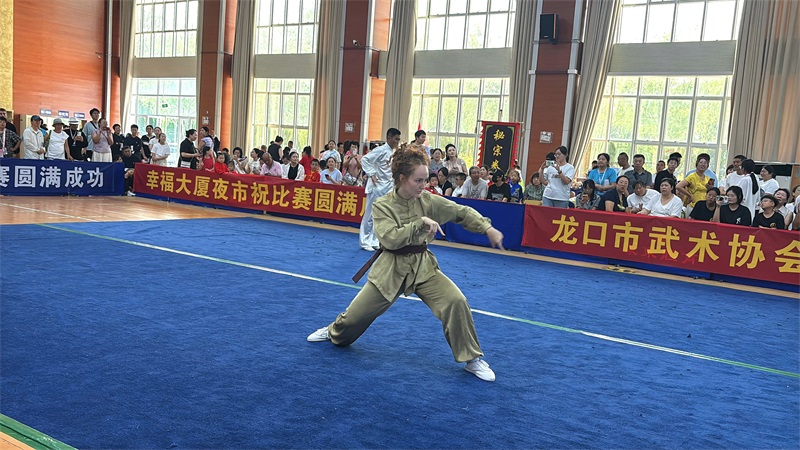 Student performing Mantis Boxing in a traditional martial arts competition Kunyu Mountain Martial Arts School student competing in traditional Mantis Boxing